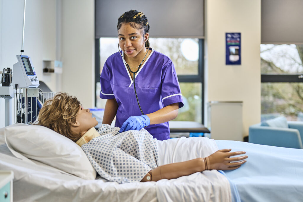 Healthcare student working on patient